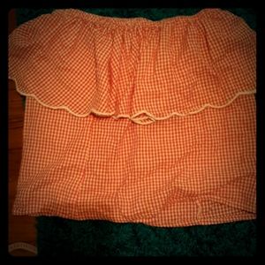 A strawberry pink shoulders down top